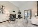 Bright living room with vaulted ceilings, a cozy fireplace, and sliding glass doors to the exterior at 4272 E 126Th Pl, Thornton, CO 80241