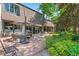 Expansive backyard with patio seating, outdoor grill, and lush greenery at 50 Albion St, Denver, CO 80220