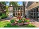 Stunning backyard with a fountain, lush landscaping, and an inviting patio area at 50 Albion St, Denver, CO 80220