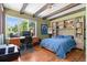 Bedroom with a large window, a desk and a bed with built-in shelving at 50 Albion St, Denver, CO 80220