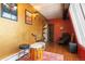 Bonus room with musical instruments, a chair, lighting and other artistic elements at 50 Albion St, Denver, CO 80220