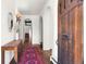 Elegant entryway with hardwood floors, arched doorways, and a decorative area rug at 50 Albion St, Denver, CO 80220