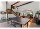 Expansive game room with ping pong table, exercise equipment, and comfortable seating at 50 Albion St, Denver, CO 80220