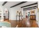 Hallway featuring arched doorways, hardwood floors, and elegant lighting fixtures at 50 Albion St, Denver, CO 80220