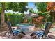 Tranquil backyard featuring a stock tank hot tub with lounge chairs, perfect for relaxation at 50 Albion St, Denver, CO 80220