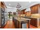 Well-appointed kitchen with custom wood cabinets, granite countertops, stainless steel appliances, and a view to the backyard at 50 Albion St, Denver, CO 80220
