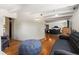 Open-concept living room showing a sitting area transitioning into the primary bedroom at 50 Albion St, Denver, CO 80220