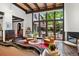 Bright and airy living room with large windows offering great views of the outdoor patio and landscaped backyard at 50 Albion St, Denver, CO 80220