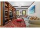 Cozy living room features custom shelving, built-in lighting, and comfortable seating, perfect for enjoying Gathering time at 50 Albion St, Denver, CO 80220