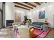 Beautiful living room featuring a fireplace, piano, large windows, and comfortable seating area at 50 Albion St, Denver, CO 80220