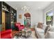 Comfortable living room features a built-in bookcase, hardwood floors, and cozy seating, perfect for relaxation at 50 Albion St, Denver, CO 80220