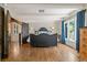 Spacious main bedroom with hardwood floors, white ceiling beams, and ample natural light at 50 Albion St, Denver, CO 80220