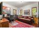 Charming office space featuring a desk, comfortable leather couch, and hardwood floors at 50 Albion St, Denver, CO 80220