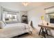 Bright bedroom with large windows offering plenty of natural light and a desk area at 2012 W 101St Ave, Thornton, CO 80260