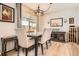 Dining room featuring a wooden table and modern light fixture for a stylish and functional dining experience at 2012 W 101St Ave, Thornton, CO 80260