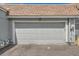 Garage showcasing its sturdy door and design, complemented by a well-kept exterior at 2012 W 101St Ave, Thornton, CO 80260