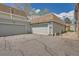 Attached garage with a paved driveway and well-maintained exterior, offering convenient parking at 2012 W 101St Ave, Thornton, CO 80260