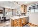 Open concept kitchen with stainless steel appliances, lots of counter space and a view of the dining area at 2012 W 101St Ave, Thornton, CO 80260