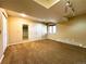 Basement with neutral carpet, large window, closet, and access to storage at 8461 Pawnee Ln, Niwot, CO 80503