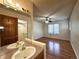 Bathroom features hardwood flooring and a vanity with a mirror and lighting at 8461 Pawnee Ln, Niwot, CO 80503