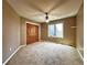 Bedroom with neutral carpet, closet, and natural light from one window at 8461 Pawnee Ln, Niwot, CO 80503