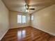 Bedroom features a ceiling fan, and wood flooring, with bright natural lighting at 8461 Pawnee Ln, Niwot, CO 80503