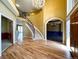 Grand foyer featuring a curved staircase, hardwood floors, and open sightlines at 8461 Pawnee Ln, Niwot, CO 80503