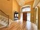 Elegant foyer with hardwood floors, a chandelier, and curved entryways at 8461 Pawnee Ln, Niwot, CO 80503