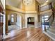 Bright foyer with a fireplace view, open floor plan and staircase at 8461 Pawnee Ln, Niwot, CO 80503
