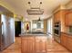 Open eat in kitchen with center island and stainless steel appliances at 8461 Pawnee Ln, Niwot, CO 80503