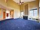 Spacious living room with fireplace, built-in shelving, and entryway view at 8461 Pawnee Ln, Niwot, CO 80503