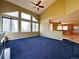 Open living room featuring vaulted ceilings and many bright windows at 8461 Pawnee Ln, Niwot, CO 80503