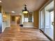 Open concept room with hardwood floors leading to kitchen and living room at 8461 Pawnee Ln, Niwot, CO 80503