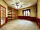 Home office with built-in bookshelves, large windows, and natural light at 8461 Pawnee Ln, Niwot, CO 80503
