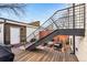 Outdoor patio featuring modern seating and unique staircase with a grill, perfect for entertaining at 4129 Zenobia St, Denver, CO 80212