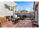 Backyard with a patio set and outdoor seating, plus stairs to an upper level; ideal for outdoor living at 4129 Zenobia St, Denver, CO 80212