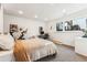 Well lit bedroom with neutral carpet, workout bike, desk, and a window view at 4129 Zenobia St, Denver, CO 80212