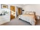 Bedroom with neutral carpet, bright light and natural wood door at 4129 Zenobia St, Denver, CO 80212