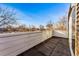 Outdoor deck with a black tile floor, white railing, and a neighborhood view at 4129 Zenobia St, Denver, CO 80212