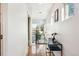 Bright hallway with stylish console and modern railings allows for natural light to flow through the interior at 4129 Zenobia St, Denver, CO 80212