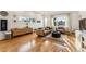 Inviting living room featuring hardwood floors, contemporary furniture, and ample natural light at 4129 Zenobia St, Denver, CO 80212