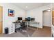 Stylish office featuring a modern desk setup and built-in shelves, bathed in natural light at 4129 Zenobia St, Denver, CO 80212