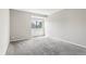 Bedroom featuring a large window and neutral wall-to-wall carpeting at 6380 S Boston St # 397, Greenwood Village, CO 80111