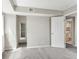 Bright bedroom with neutral carpet and ensuite access at 6380 S Boston St # 397, Greenwood Village, CO 80111