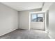 Neutral bedroom with large window and plush gray carpet at 6380 S Boston St # 397, Greenwood Village, CO 80111