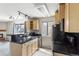 Well-lit kitchen with granite counters and stainless steel sink at 6380 S Boston St # 397, Greenwood Village, CO 80111