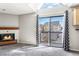 Living room featuring a fireplace, balcony, and vaulted ceilings at 6380 S Boston St # 397, Greenwood Village, CO 80111