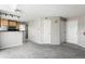Open-concept living area with neutral paint and carpet flooring at 6380 S Boston St # 397, Greenwood Village, CO 80111