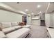 Large basement space with a sectional sofa, carpet flooring, and bright lighting at 1495 W 137Th Ave, Broomfield, CO 80023