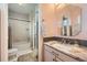 Bathroom vanity featuring marble countertop, sink, and shower and toilet in background at 1495 W 137Th Ave, Broomfield, CO 80023
